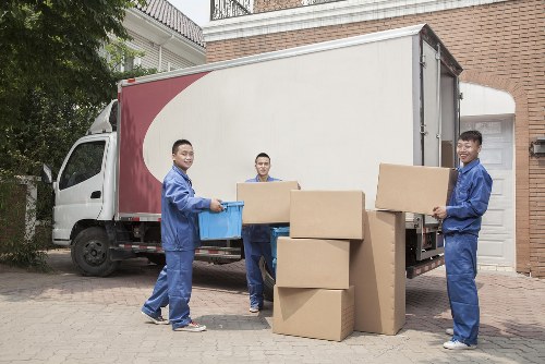 Professional man and van service loading belongings in West Norwood