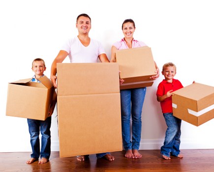 Movers handling a flat relocation in a West Norwood street