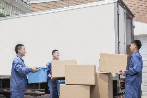 House movers loading furniture in West Norwood street setting