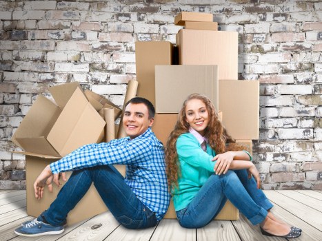 Removal team packing a family home for a move