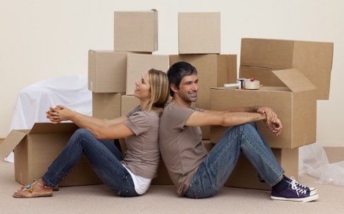 Boxes and furniture being loaded for a local removal service