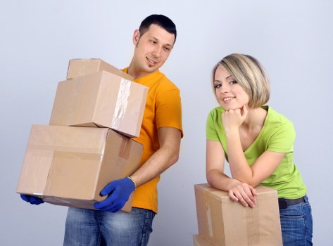 Office desks and boxes prepared for commercial relocation