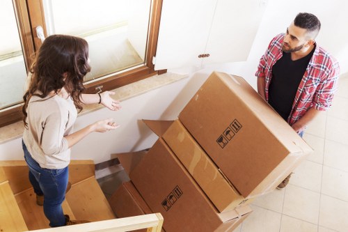 Packed boxes and household items ready for removal