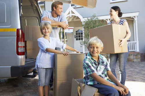 Unpacking household items into a West Norwood home after moving