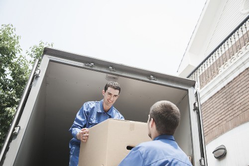 Packed boxes and furniture prepared for a man and van move in West Norwood